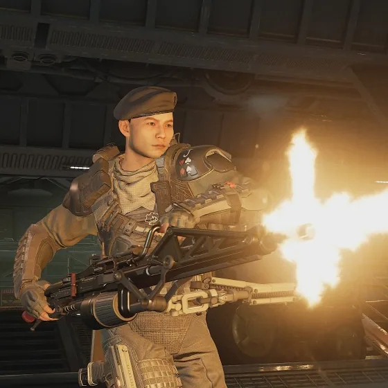 Specialist class marine firing a smartgun